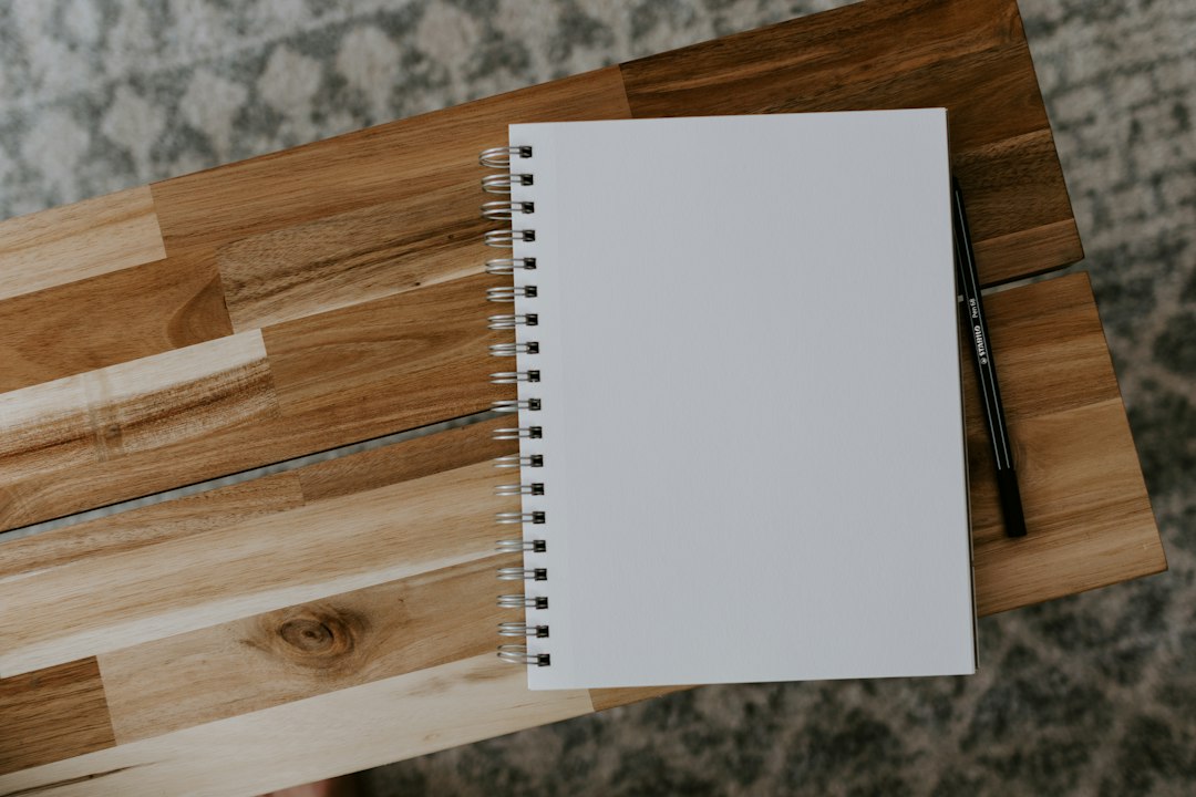 Open notebook on a wooden desk