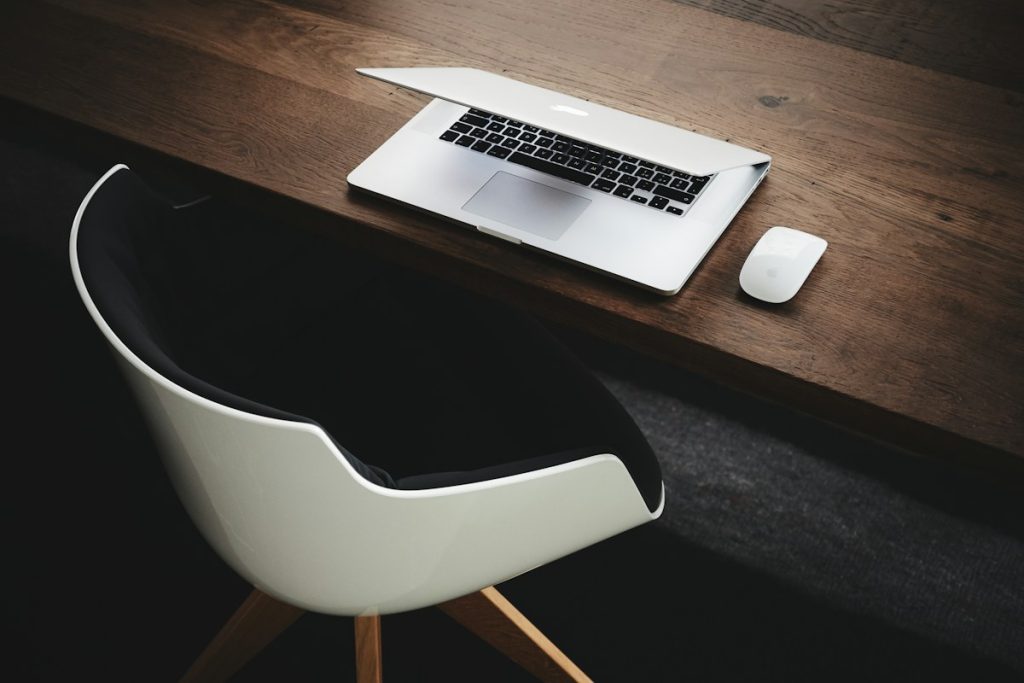 An organised office workspace with a computer and desk accessories, without people